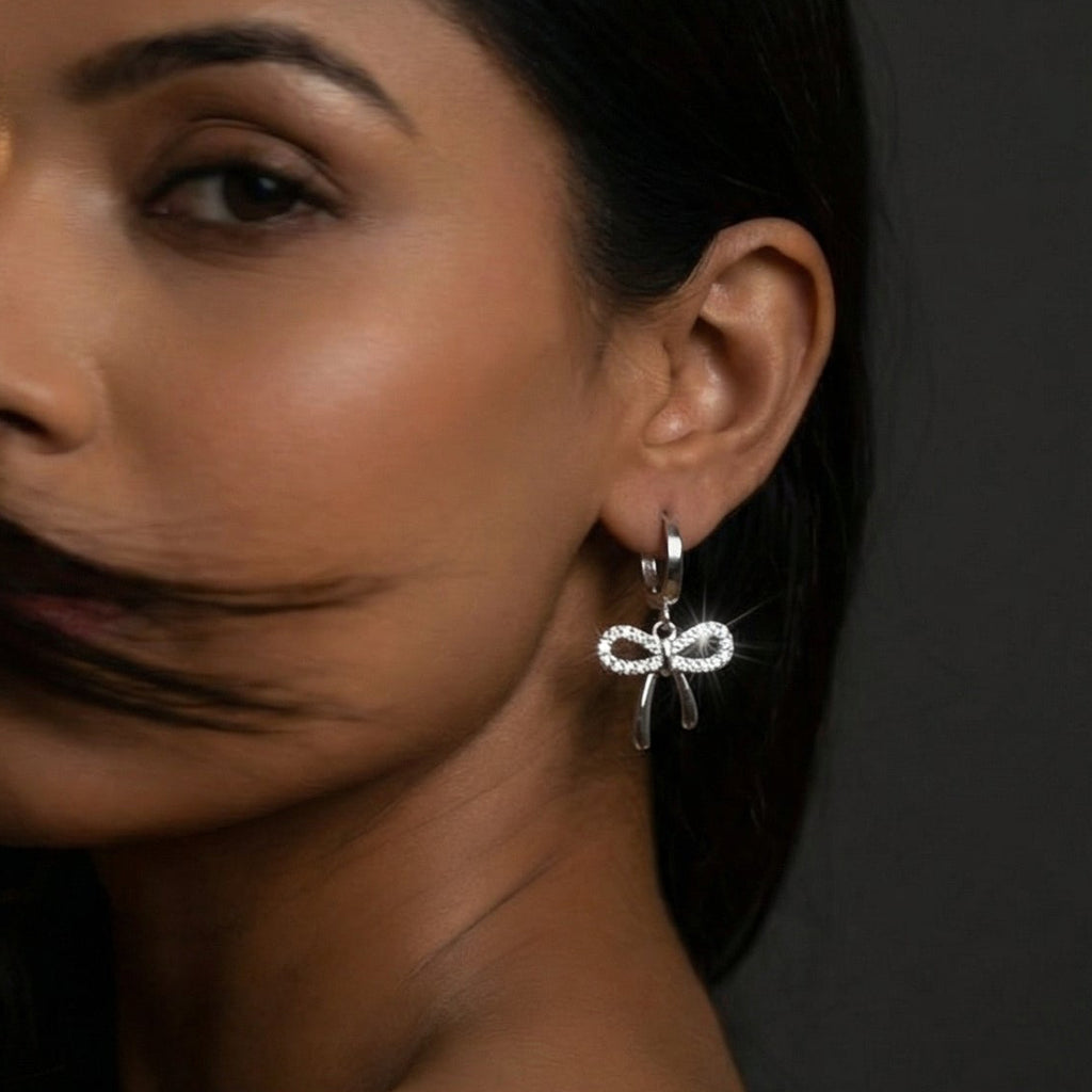 Butigini Silver Plated American Diamond Studded Bow Tie Korean Hoop Earrings