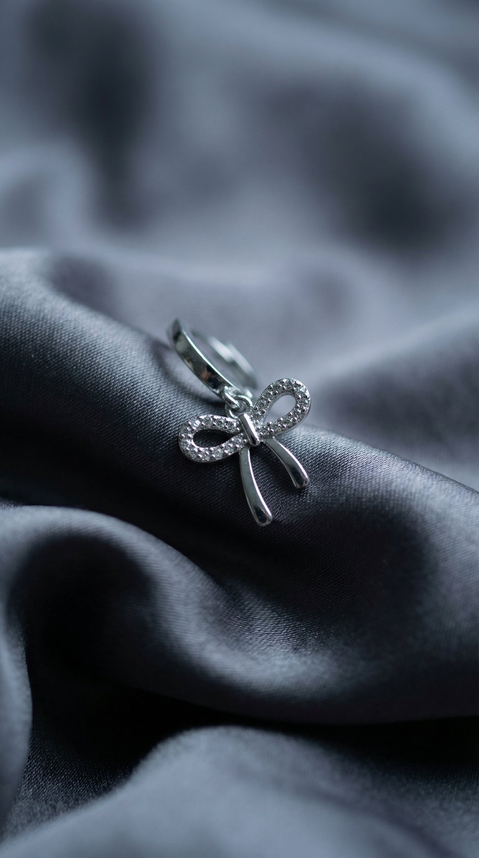 Butigini Silver Plated American Diamond Studded Bow Tie Korean Hoop Earrings