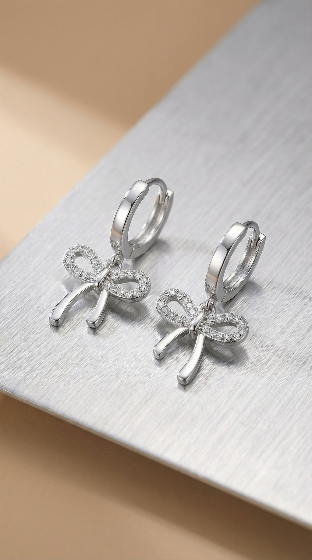 Butigini Silver Plated American Diamond Studded Bow Tie Korean Hoop Earrings