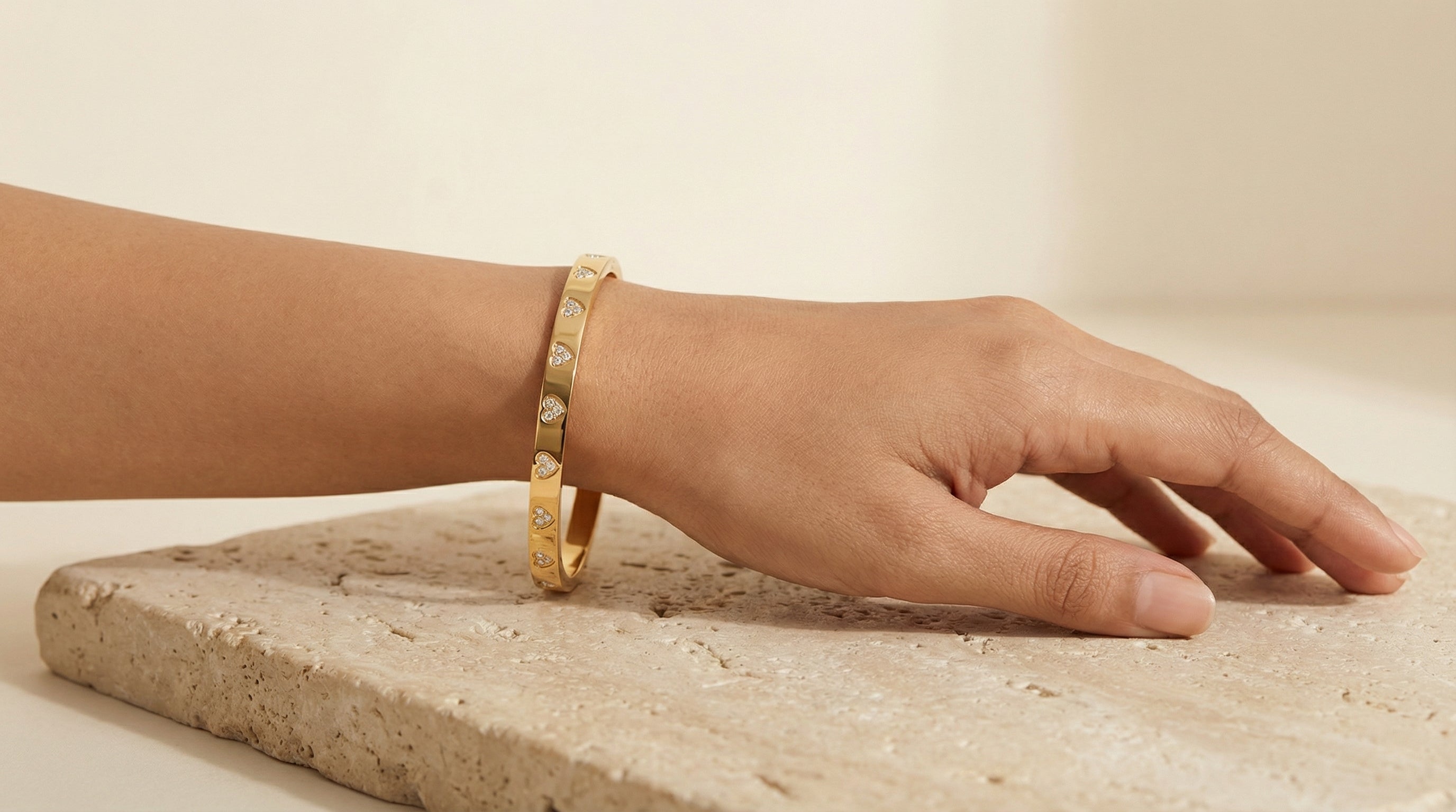 Butigini Gold Plated American Diamond Studded Heart Motif Bangle Bracelet